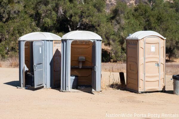 a clean row of portable restrooms for outdoor weddings or festivals in Jber, AK